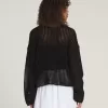 Mila – Kurzer Rundhalspullover mit offenem Strickmuster Mila – Kurzer Rundhalspullover mit offenem Strickmuster